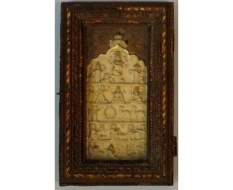 An Andhra Pradesh or Telengana plaque, the cream ceramic shaped arched tile relief moulded with deities, camels, figures and 