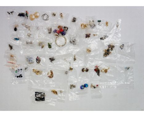 A bag of vintage and modern earrings, both clip on and for pierced ears, to include plastic, enamelled, jewelled, gold tone s