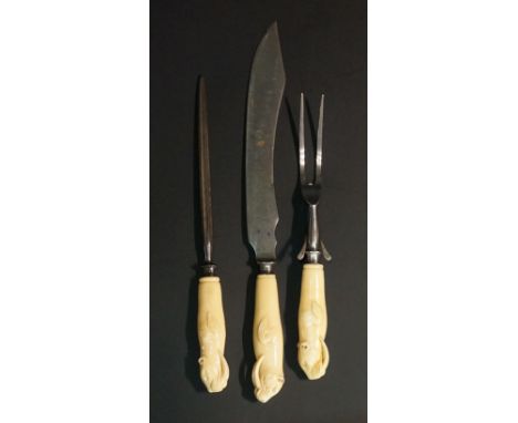 A rare set of three 19th Century marine ivory handled carving implements, comprising steel, knife and fork, each handle finel