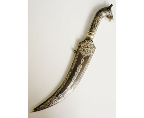 A Persian silver damascened iron dagger with horse head handle, finely folded blade, the scabbard with floral scrolls, pendan