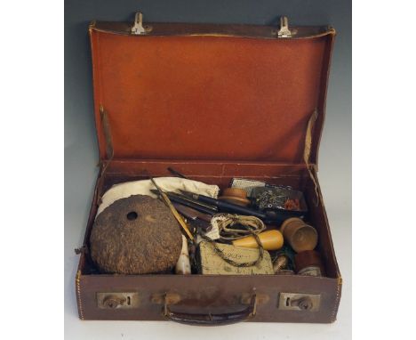 A leather case containing large quantity of keys, sovereign scales, pen and other knives, treen rule, box, cup, bone needleca