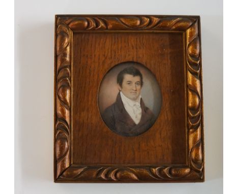 A 19th Century head and shoulder portrait miniature of a gentleman wearing brown coat and white cravat, oval, watercolour on 