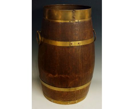 An oak stick stand of barrel shape with brass coopered bands and pair of ring carrying handles, 48cm high, early 20th Century