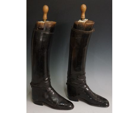A pair of ladies black leather riding boots with boot trees inscribed Lady Gillian Pepys, Peel & Co Ltd, London, 58cm high ov