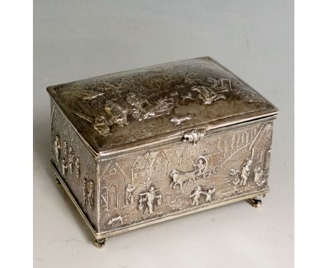 A good very early 20th Century Continental silver casket form trinket box, the lid and sides elaborately chased and embossed 