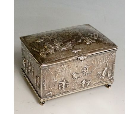 A good very early 20th Century Continental silver casket form trinket box, the lid and sides elaborately chased and embossed 