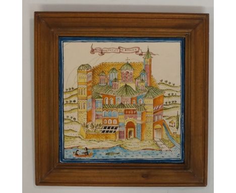 A Greek pottery tile decorated with a stylised town, banner above inscribed, initialled lower right, 21.5cm square, framed