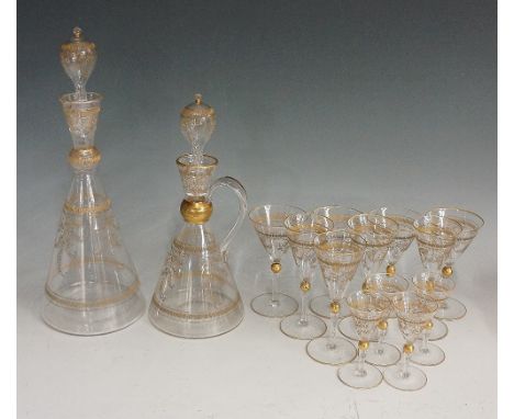 A decanter set comprising decanter, second handled liqueur decanters and twelve matching glasses in three different sizes, al