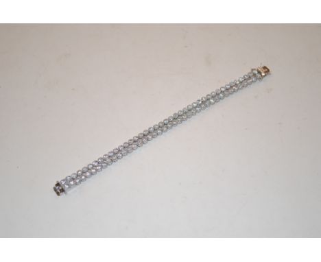 A Sterling silver and cubic zirconia double row tennis style bracelet, approx. 20.6gms 