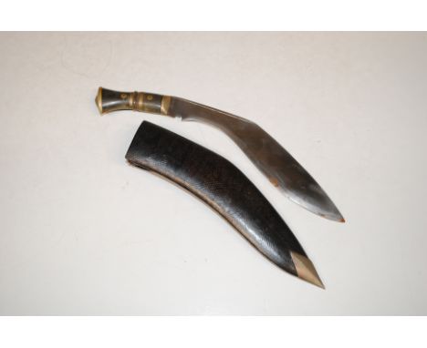 A decorative Kukri in scabbard. This item can only be purchased by someone over the age of 18 and ID verification may be requ