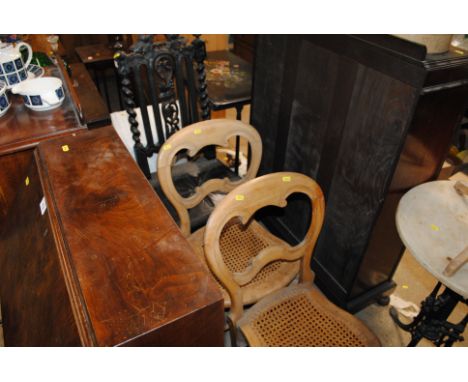 A 19th Century carved oak hall chair, two walnut cane seated bedroom chairs and a loom corner linen basket