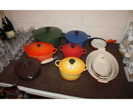 A quantity of Le Creuset cooking pots, saucepans, oven dishes, frying pan, and a Cousances frying pan