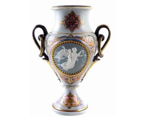 H Ardant & Co twin handled vase circa 1870, decorated with a lady and cherub in a jasper/ pate sur pate style, pad mark to ba