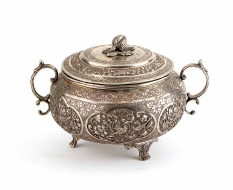 Persian silver two-handled covered bowl, body of round squat form on three paw feet, chased floral and foliate decoration, si