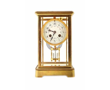 A 19th century brass framed four glass mantel clock. The enamel dial has Arabic numerals, coloured swags of flowers and stamp