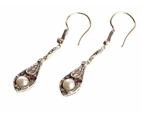 An early 20th century pair of 18ct white and yellow gold seed pearl, ruby and diamond drop earrings, pear-shaped drops contai