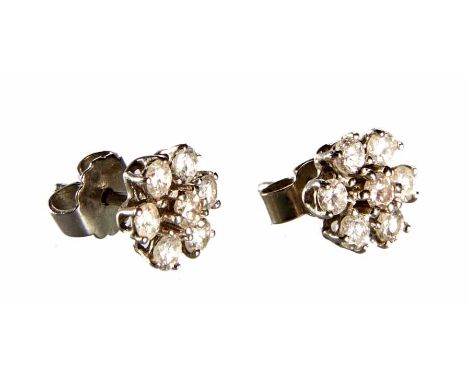 Pair of 18ct white gold diamond flower head cluster earrings, each comprising seven claw set round brilliant cut diamonds, to