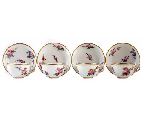 Four Sevres teacups cups and saucers, painted with floral sprays within gilt borders, painted marks to bases, late 18th, earl