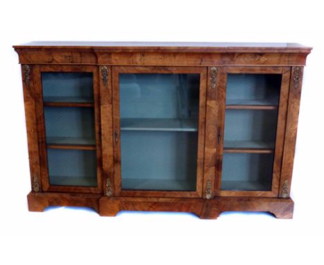 Victorian walnut breakfront bookcase or display cabinet, top with frieze inlaid with white wood parquetry, above three glazed