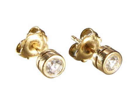 Pair of diamond solitaire 18ct yellow gold stud earrings, rub-over collette settings, the 2 round brilliant cut diamonds weig