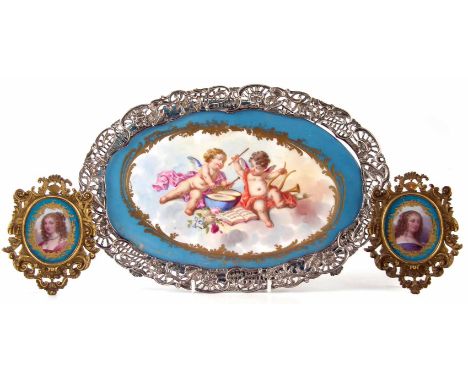 Pair of porcelain framed plaques and an oval panel mounted as a tray, probably Sevres, the plaques painted with portraits of 