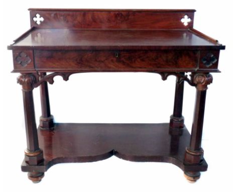 Victorian mahogany side table of Gothic design, back board above rectangular frieze with single drawer, all standing on four 