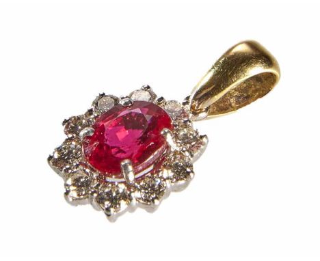 Ruby and diamond 18ct gold cluster pendant, central mixed cut oval ruby weighing approx. 1.50 carat, four claw set to 18ct wh