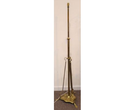 Early 20th century Art Nouveau style brass standard lamp, reeded and scrolled decoration on tripod base, H159cm Condition Rep
