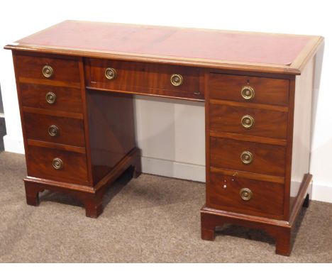Georgian style mahogany twin pedestal writing desk, the moulded rectangular top with inset writing surface, above one long an