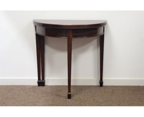 Late 19th century mahogany demi lune card table, the fold over top revealing a green baize lined playing surface, square tape
