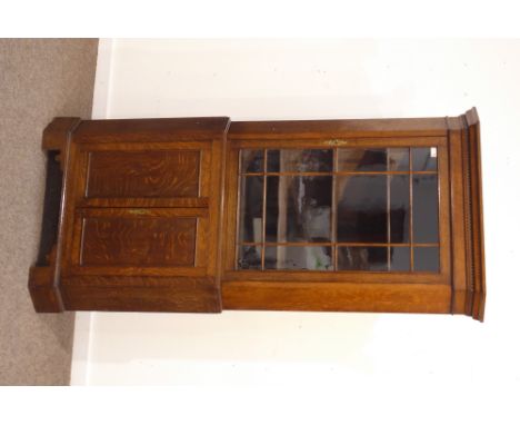 Georgian style oak floor standing corner display cabinet, projecting dentil cornice over astragal glazed door enclosing three