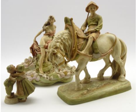 Royal Dux figure of a boy on a plough horse H35cm, a Royal Dux water lily bowl with classically draped female figure H30cm an