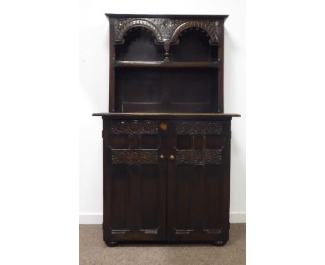 Mid 20th century Welsh oak dresser, raised back with single shelf, two panelled cupboard doors to base, squashed bun feet, ca