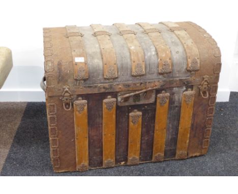 Large 19th century wood and metal bound dome top trunk, with embossed metal decoration, W82cm Condition Report & Further Deta