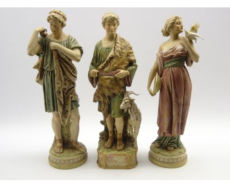 Pair of Royal Dux male and female classical figures, H54cm each and another of a goat herd H53cm all in blush ivory and with 