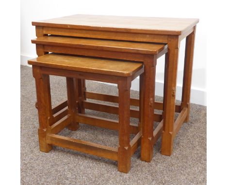 Nest of three Robert 'Mouseman' Thompson adzed oak tables, each with octagonal supports, stretchers and mouse signature, W61c