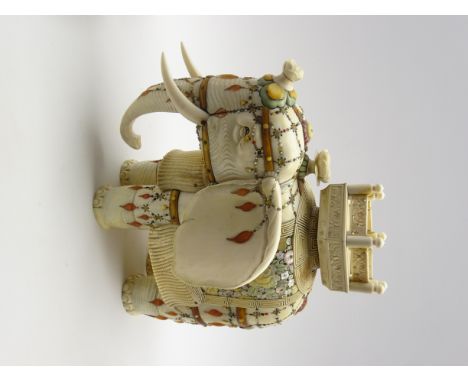 Japanese Meiji period signed model of an ivory and Shibayama elephant, standing with its trunk lowered, with howdah and decor