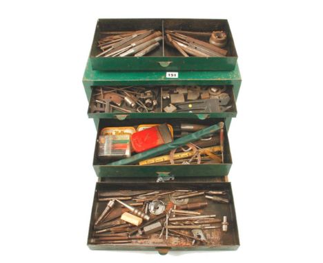 A four drawer metal tool box with various engineers tools G