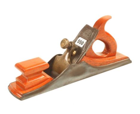 A 131/2" iron panel plane with brass lever and recent mahogany infill and handle screwed through the sole G