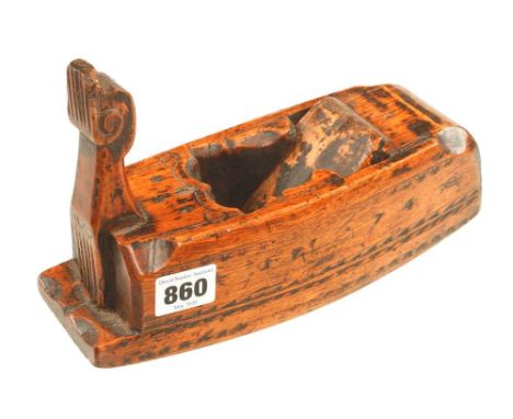 An 18c German skew mouth compass plane in hornbeam with punch decoration and dated 1774 with unusually styled front tote (see
