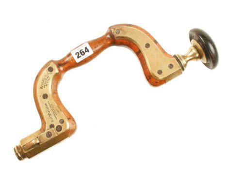 A registered beech brace by Robt MARPLES with heavy brass plates, ivory ring missing from ebony head and novel locking mechan