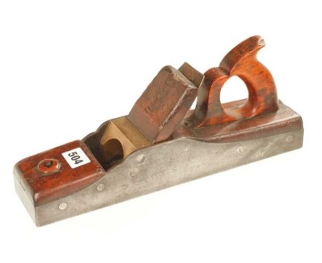 A 131/2" iron panel plane with overstuffed infill and wedge behind brass bar G+