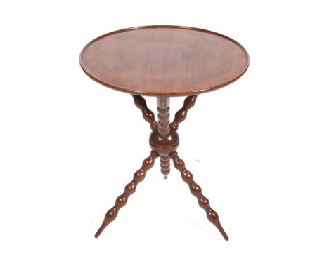 A Victorian mahogany Gipsy Table. With dished circular top on three bobbin turned crossed legs, H67cm x D55.5cm  