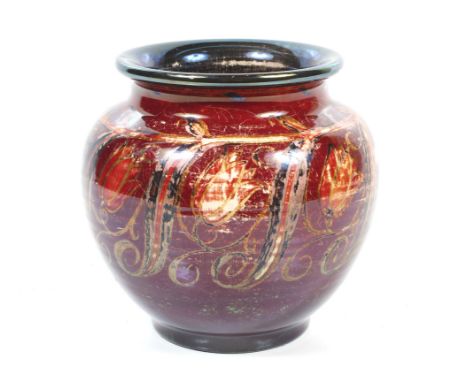 A Royal Lancastrian vase designed by William S Mycock. Glazed in red and gold lustre, with impressed marked to the base, sign