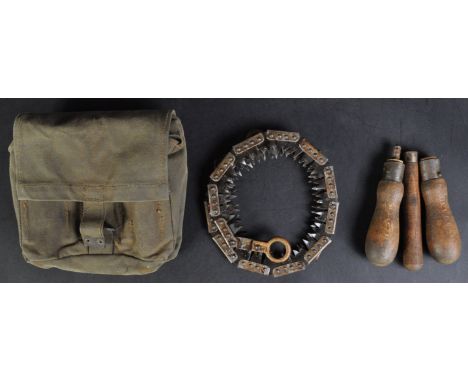A WWII Second World War British Army&nbsp;chainsaw / coil saw with handles and canvas pouch. The pouch having broad arrow ins