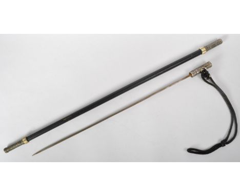 A 19th Century Victorian gentleman's sword stick / walking cane with concealed blade. The cane having a silver grip engraved 