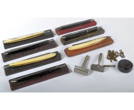 A collection of original vintage British and German made cut throat razors with Bakelite and ivorine side panels and original