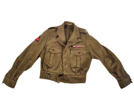 An original WWII Second World War period British 4th Infantry Division battle dress uniform tunic. The tunic having the forma