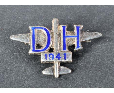 A scarce original WWII Second World War period De Havilland Aircraft Company silver and enamel employee's badge. Blue enamel 