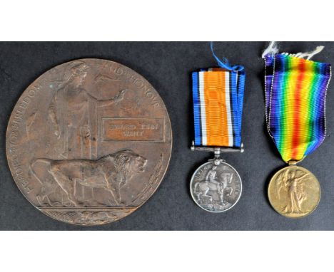 A WWI First World War British Army medal pair and Memorial Plaque awarded to one 1377 Private E.J Waitt 1st / 10th Battalion 